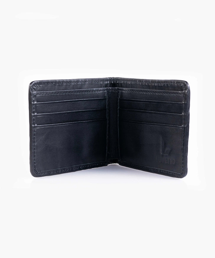 Interior of the Luvetto trifold wallet showing card slots and Serafil German thread stitching.