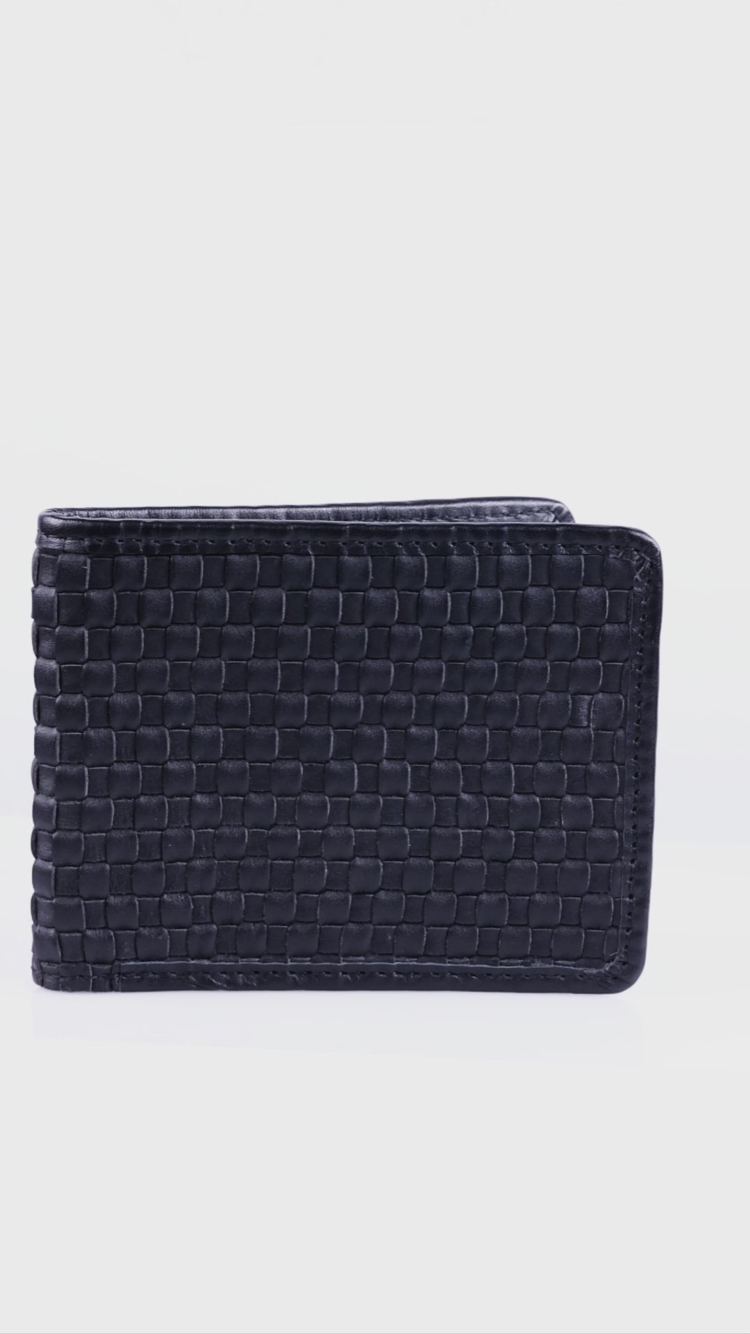 A close-up video demonstration of the Luvetto trifold wallet, highlighting its natural leather patina, flexibility, and handmade construction.